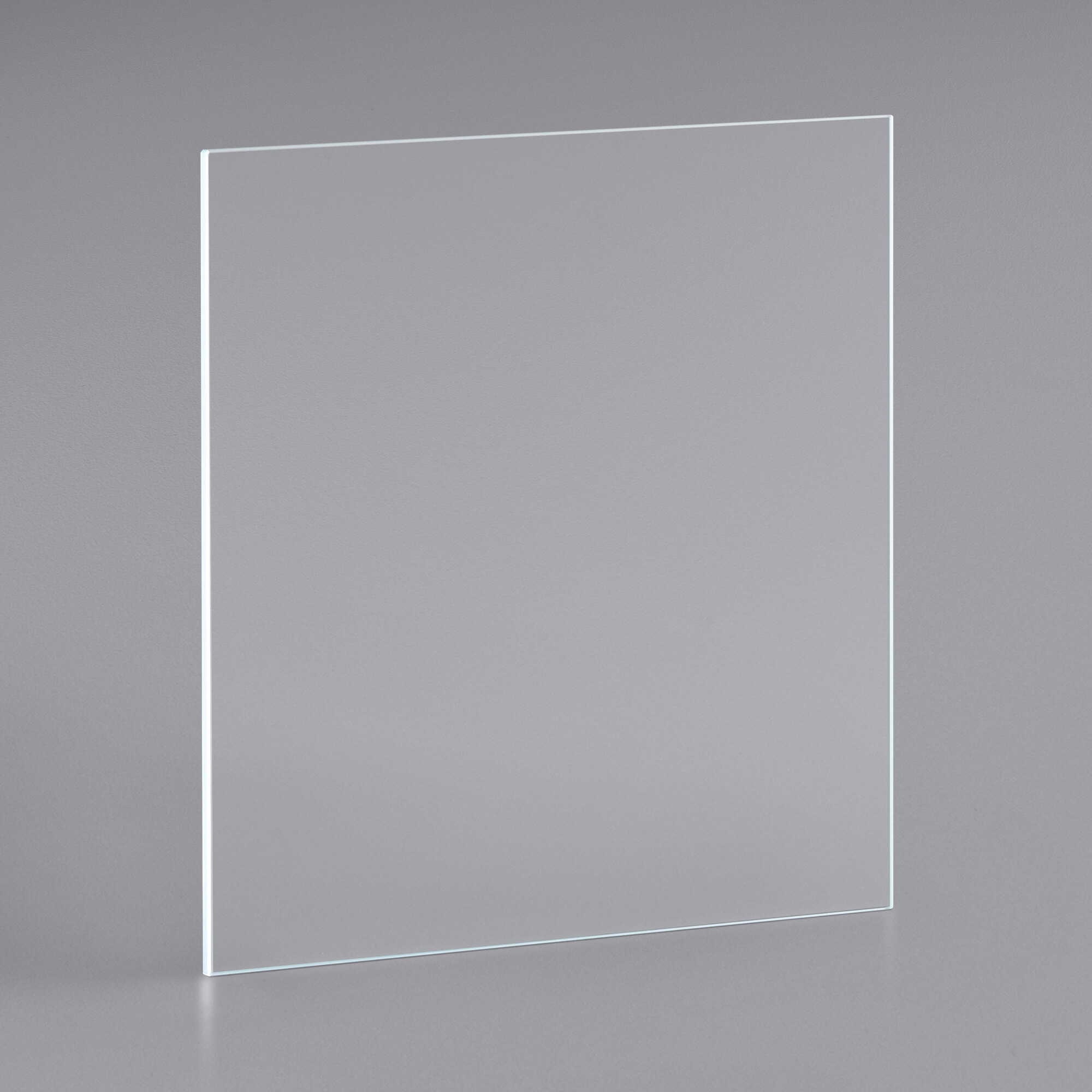 A clear glass panel on a gray surface with a white rectangular frame.