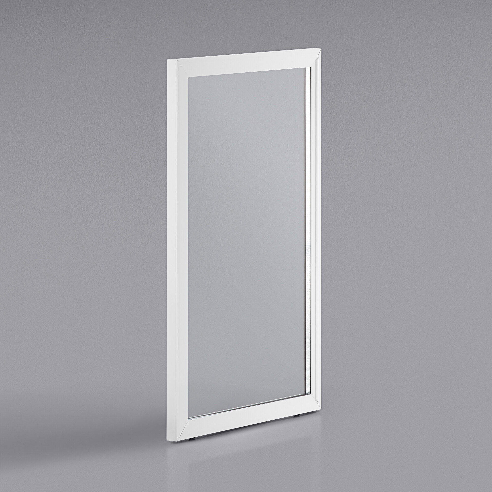 a white rectangular mirror on a grey surface