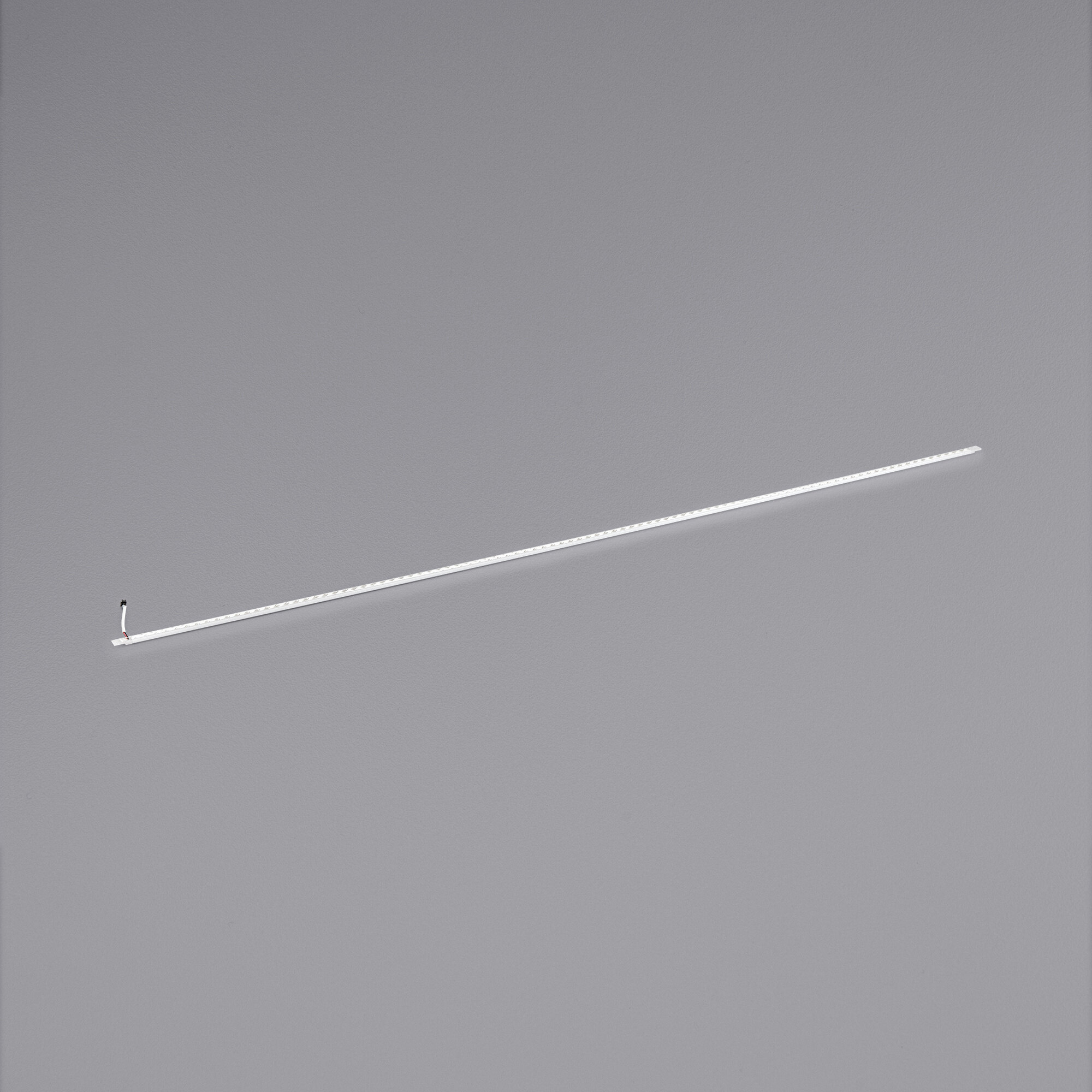An Avantco long white lamp for refrigeration hanging from the ceiling.
