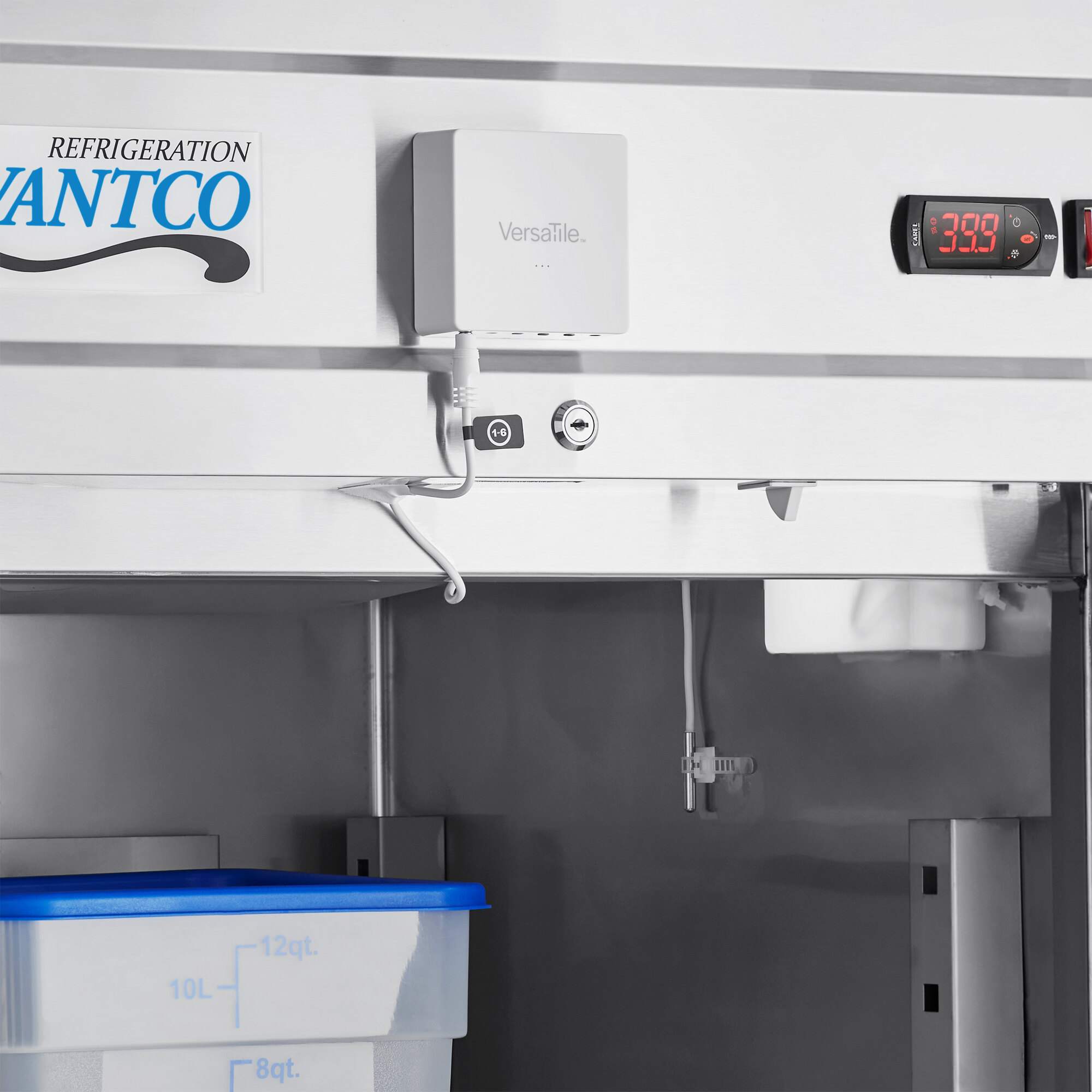 A VersaTile air temperature probe in a blue container in a freezer.