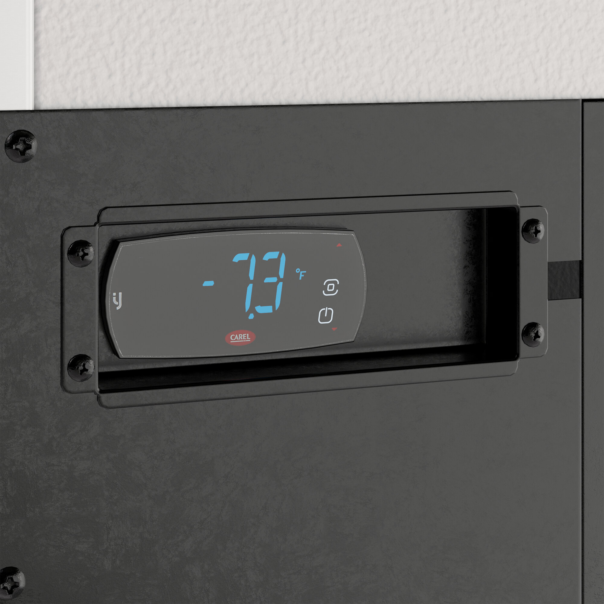 A digital temperature control panel on a black worktop freezer.