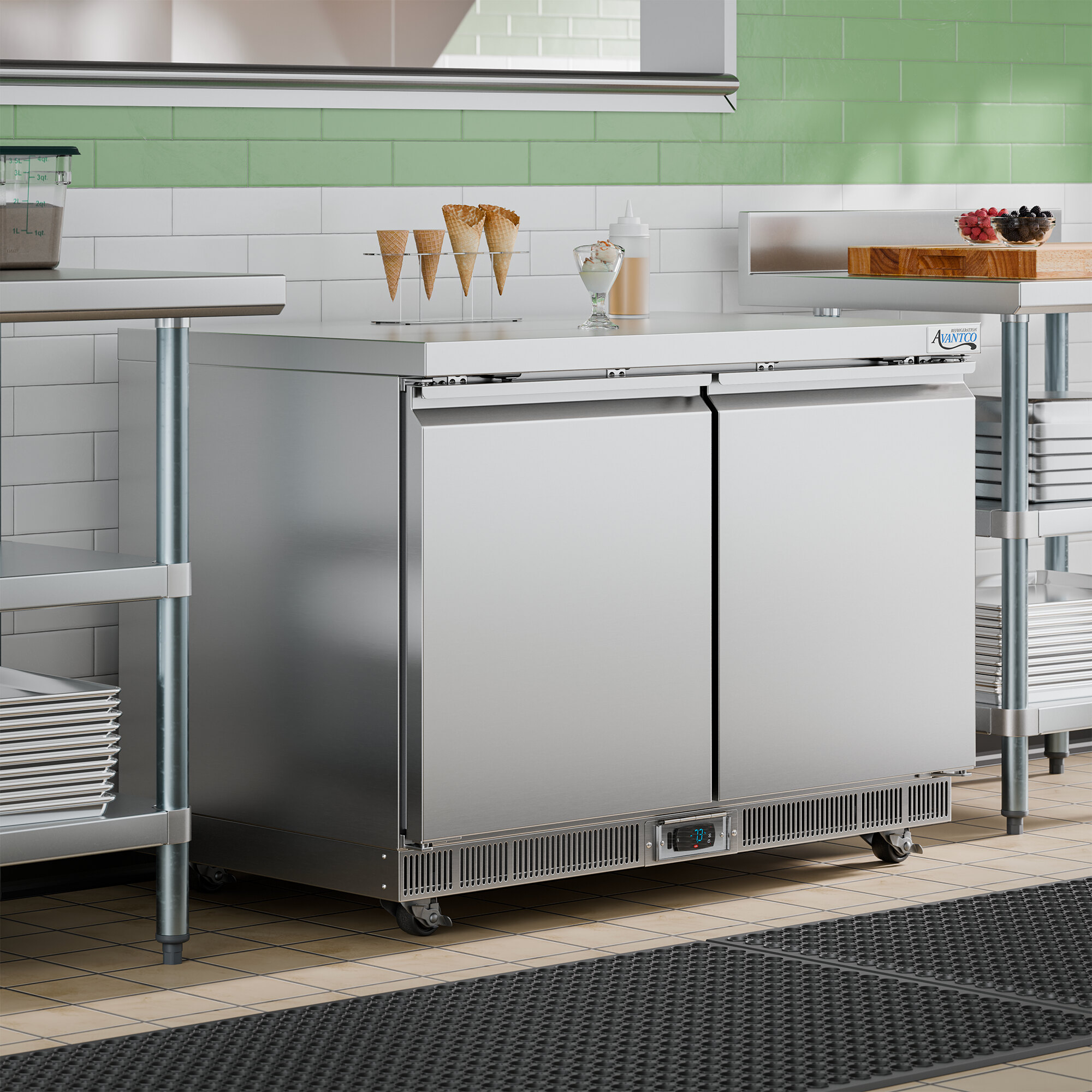 A stainless steel, double-door undercounter freezer with a digital control panel, designed for commercial kitchen use.