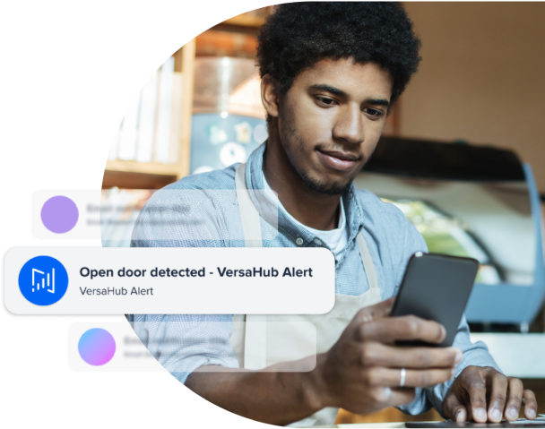 man using versa hub dashboard on smartphone