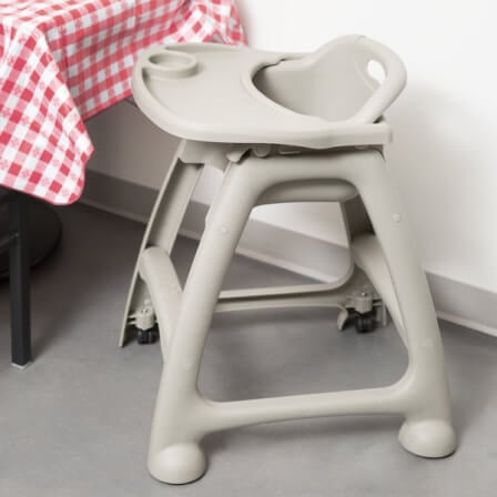 high chair at a table with checkered tablecloth