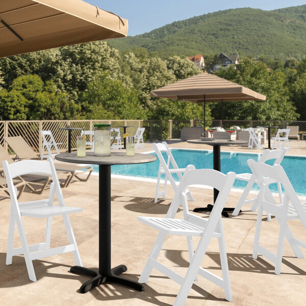 outdoor metal table and chair on landscaped patio