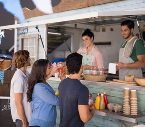 Customers buying food from a food truck