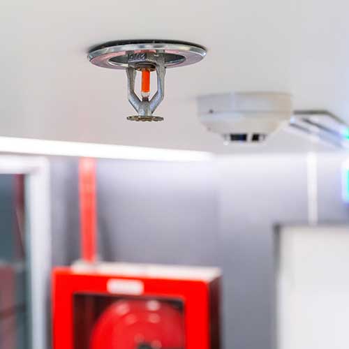 fire sprinkler on ceiling of office