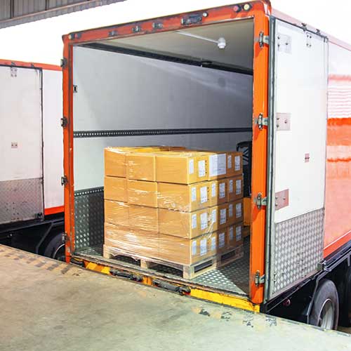 trailer truck parked loading at dock warehouse loaded with cargo containers