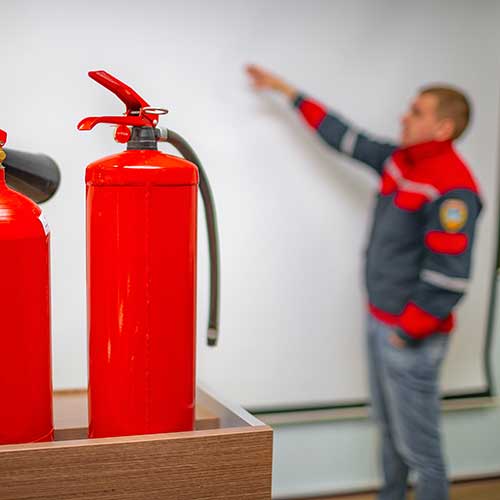 uniformed fireman gives a lecture on fire safety