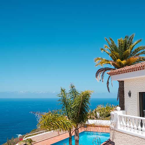 italian style house with swimming pool palm trees and ocean sea view
