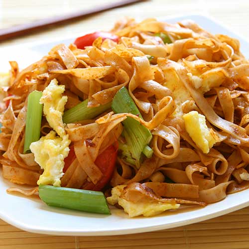 chinese egg noodles on white china plate