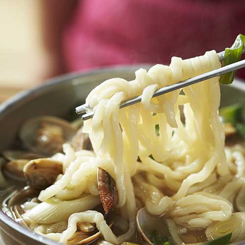 kalguksu in bowl with chopsticks