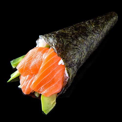 temaki sushi with salmon avocado and cucumber on black background