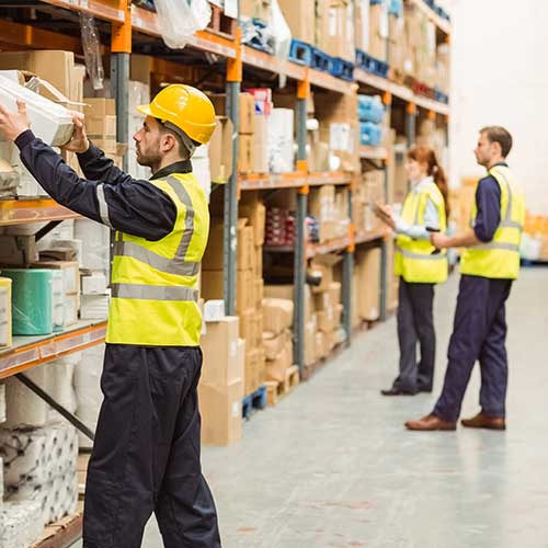 warehouse worker taking package off the shelf