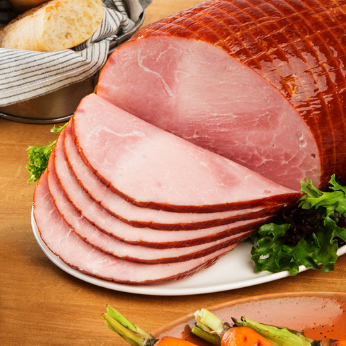 Whole ham with five slices cut