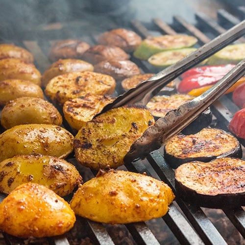 Grilled peppers and zucchini prepared as side dishes for an asado