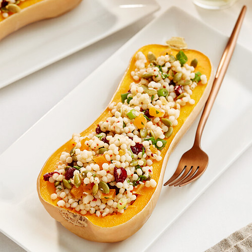 Squash stuffed with Israeli couscous and vegetables