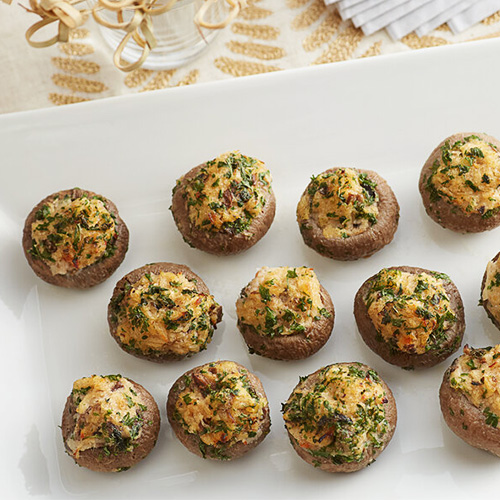 Stuffed mushrooms on a white platter