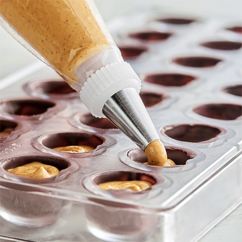 image of praline being filled into a baking mold