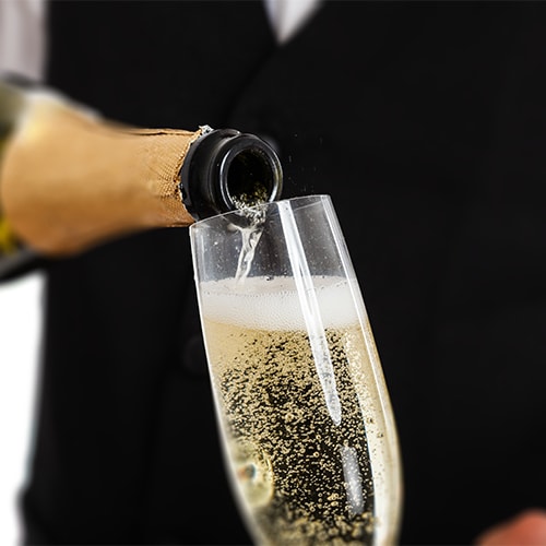 Champagne being poured into a glass