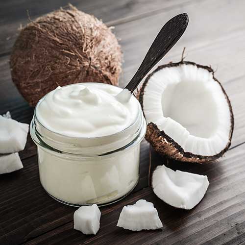 coconut cream in glass jar with fresh coconut