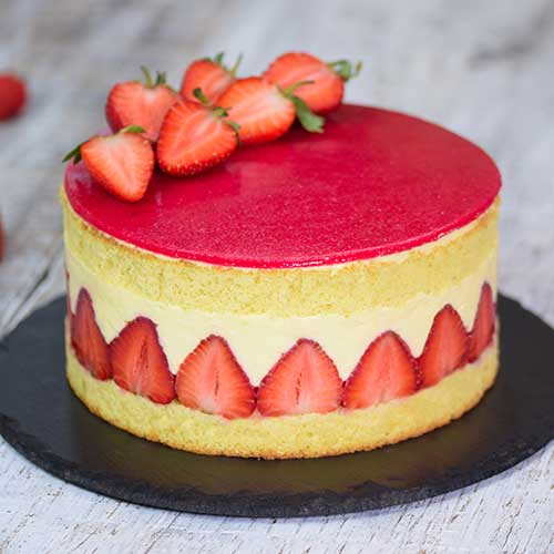 fraisier cake on wooden background