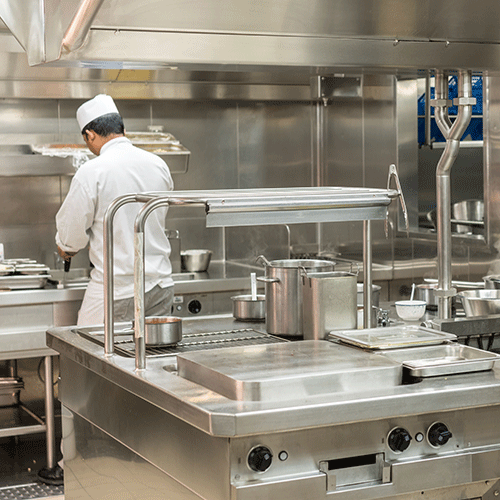 chef preparing food in commercial kitchen