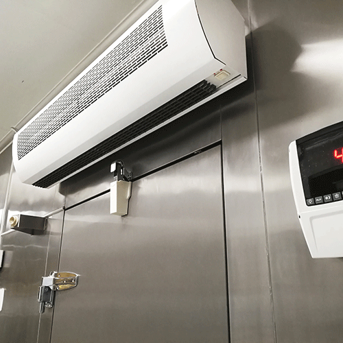 an air curtain above the entrance to a cold storage room