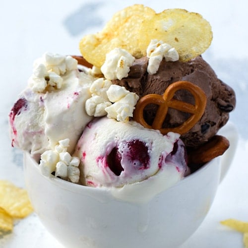 chocolate and vanilla ice cream with berries pretzel salty popcorn and potato chips