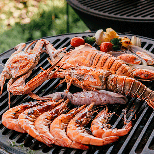 lobster and seafood variety cooking on grill