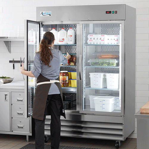woman taking food out of avantco refrigerator