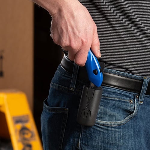 man holstering a blue box cutter