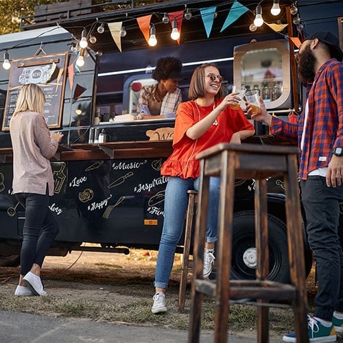 People hanging out at food truck