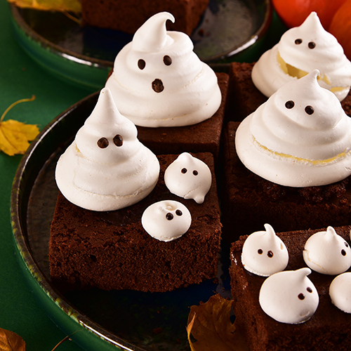 marshmallow ghosts sitting on top of brownies