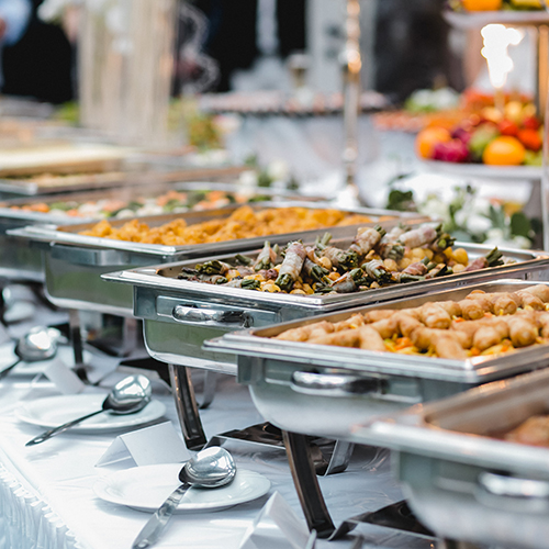 Food sitting at a buffet table