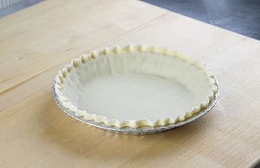 Crimp the pie crust edge.