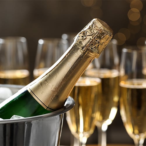 Closeup of a bottle of champagne in an ice bucket