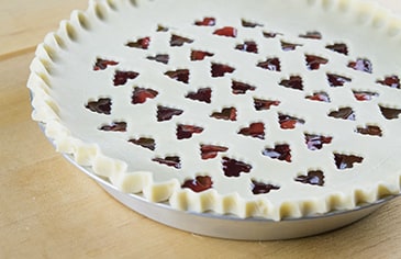 Crimp the bottom and top pie crust edges together and bake according to your recipe's instructions.