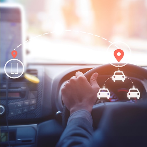 someone driving a car with location icons beside them