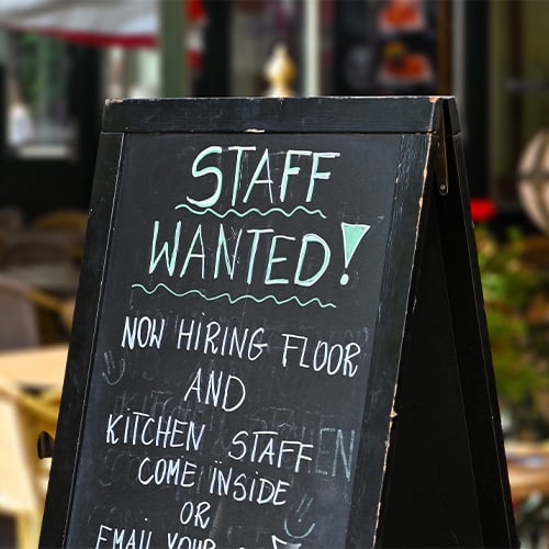 'Staff wanted' sign outside restaurant