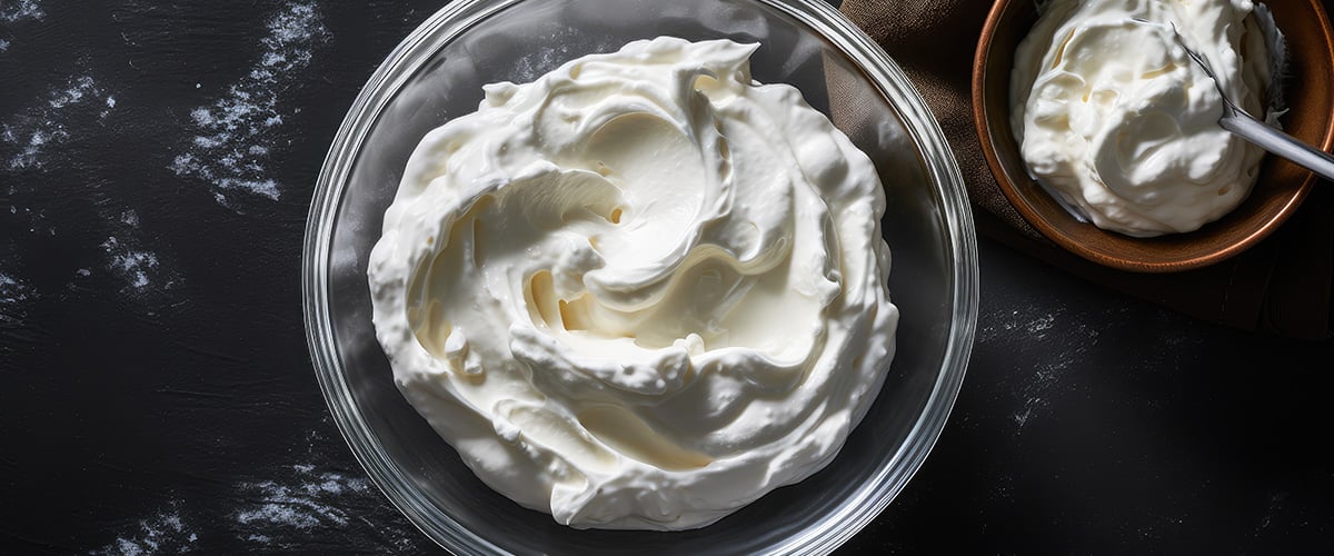 Bowls of whipped cream on a tabletop