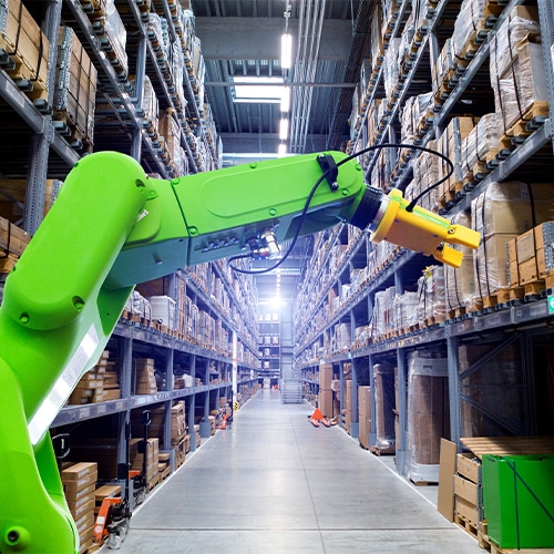robotic arm selecting packages off warehouse shelf