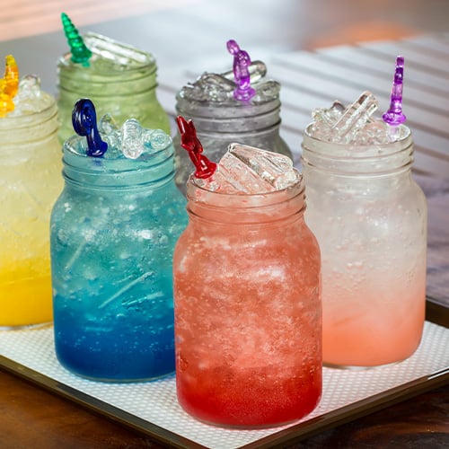 An assortment of Italian Soda flavors in glasses with ice