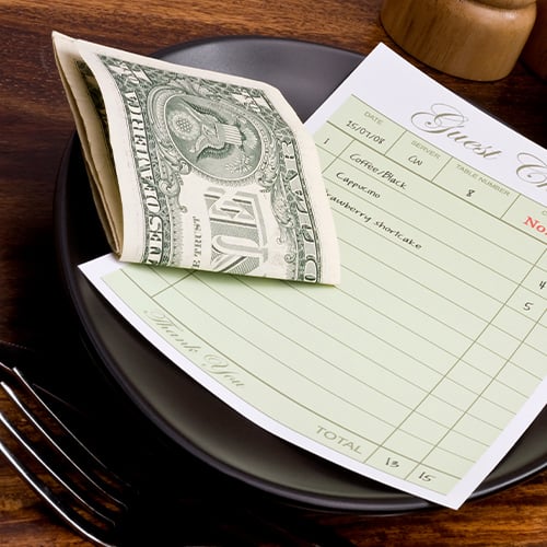 Cash tip left inside a checkbook 