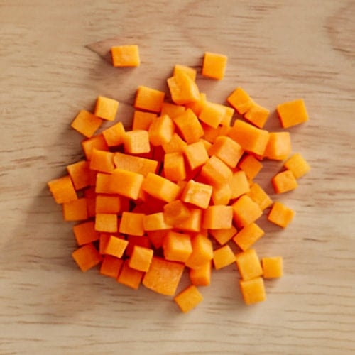 brunoise carrots on a cutting board