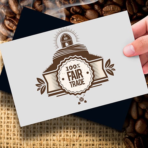 100% Fair Trade brown and white sign