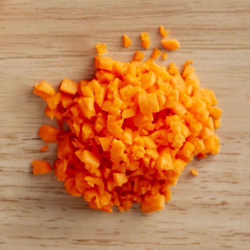 minced carrots on a cutting board