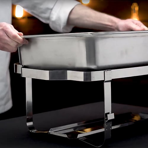 placing a water pan into a chafing dish frame