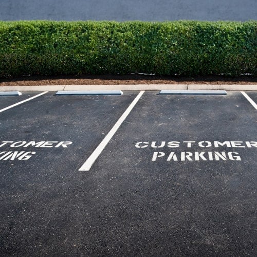 Empty parking spaces labeled as customer parking