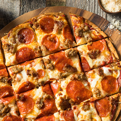 St. Louis pizza on wooden table